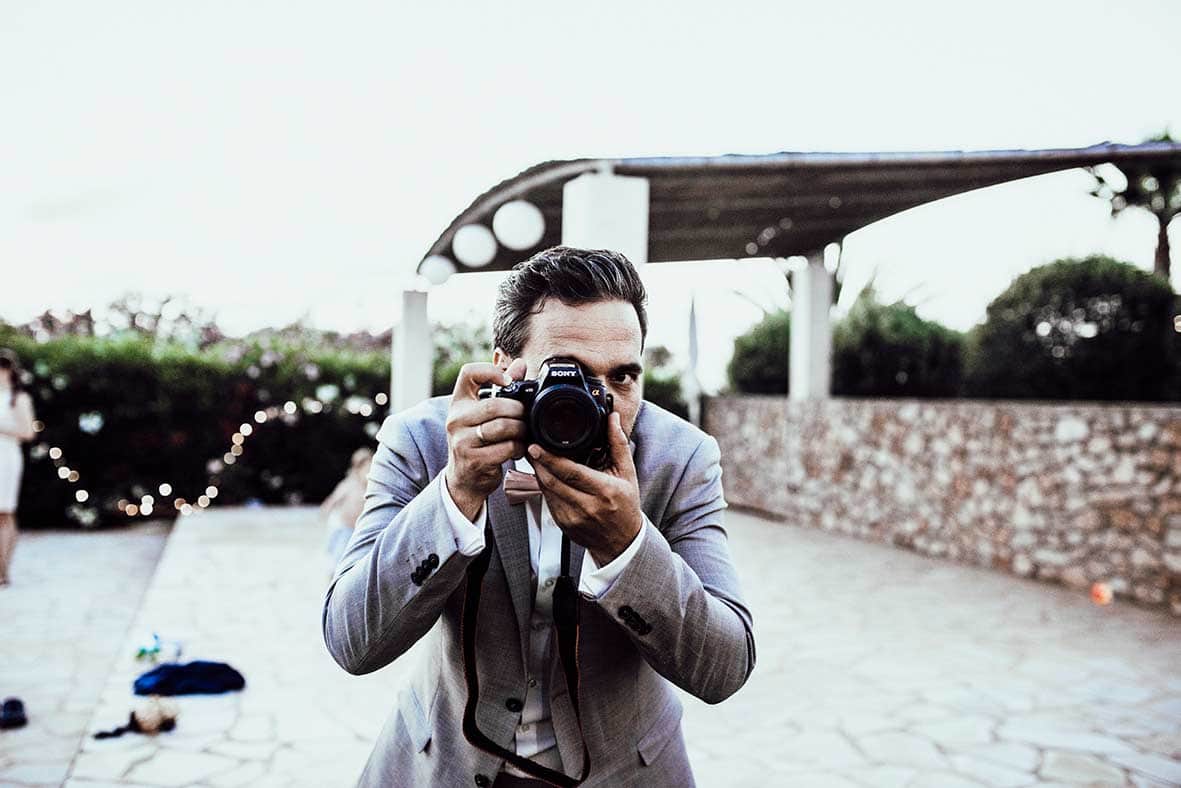 wedding photographers mallorca groom camera